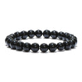 Black obsidian beaded bracelet over white background