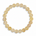 Yellow citrine beaded bracelet on a white background