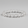 Clear quartz bracelet on a gray background