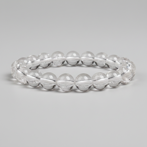 Clear quartz bracelet on a gray background