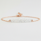 Gold tone bracelet with clear quartz on a light gray background