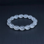 Twisting clear quartz bracelet on a dark gray background