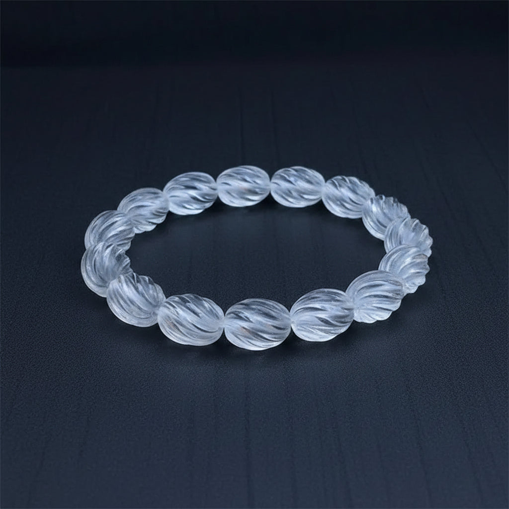 Twisting clear quartz bracelet on a dark gray background