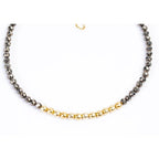 Beaded pyrite nugget bracelet with gold metal beads on white baclground.