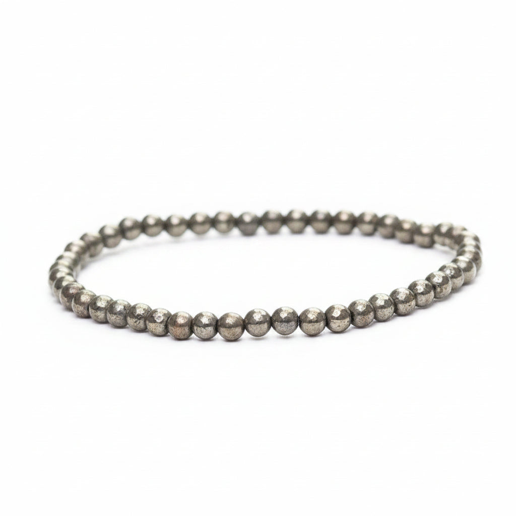 Pyrite round bead bracelet on a white background.